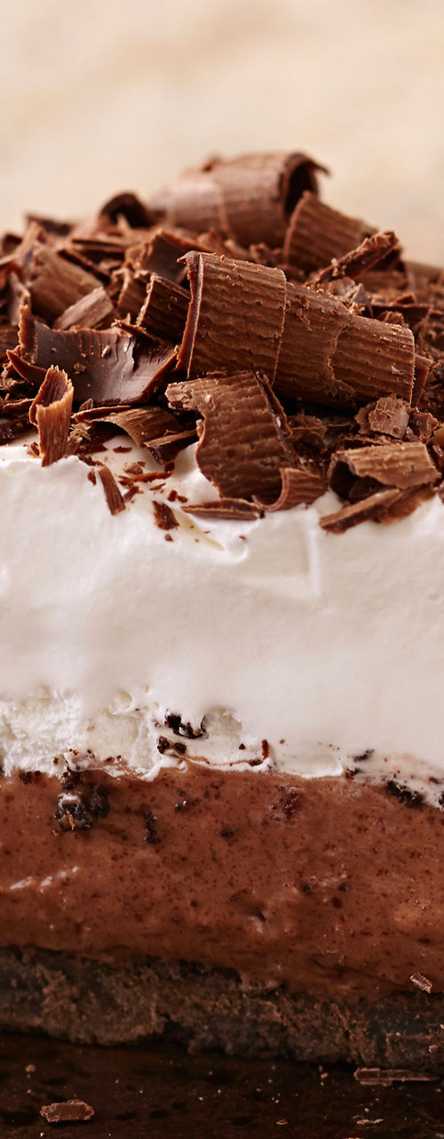 Chocolate cream pie slice on bronze plate