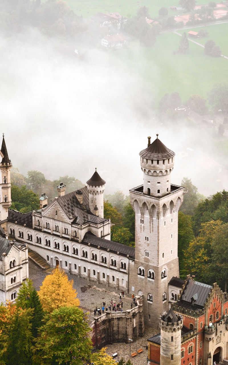 Neuschwanstein Castle in misty forest