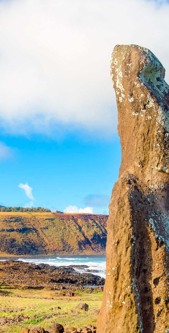Easter Island Moai statues under blue sky