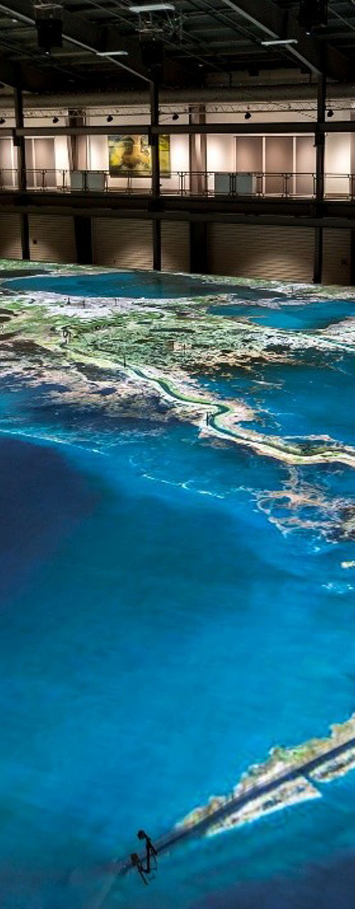 Large-scale coastal map in exhibition hall