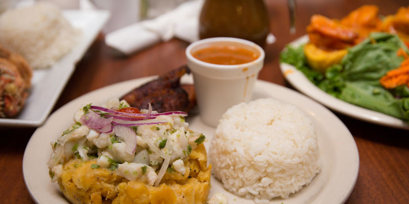 Traditional Latin meal with mofongo and rice