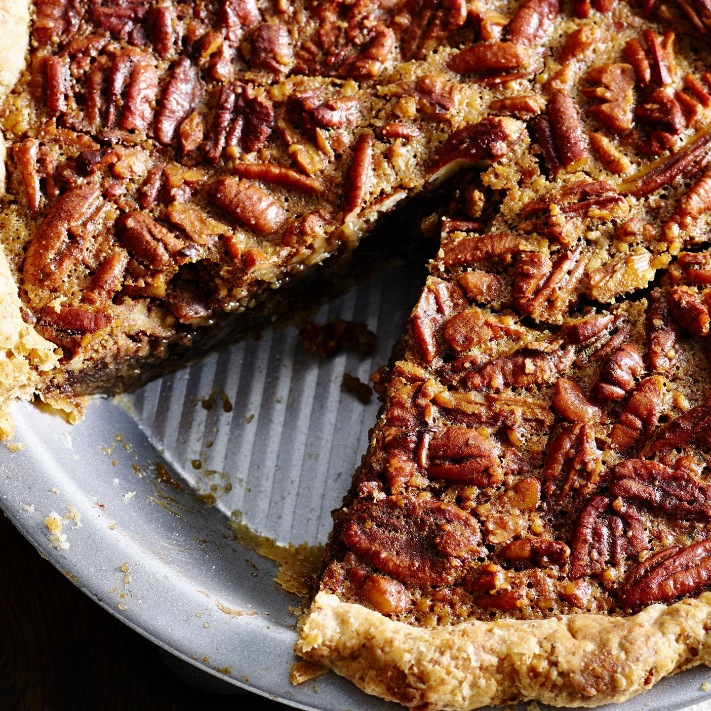 Homemade pecan pie with whipped cream