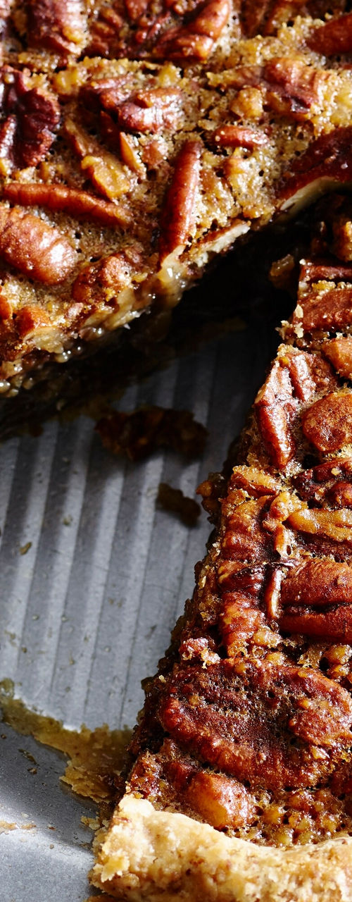 Homemade pecan pie with whipped cream