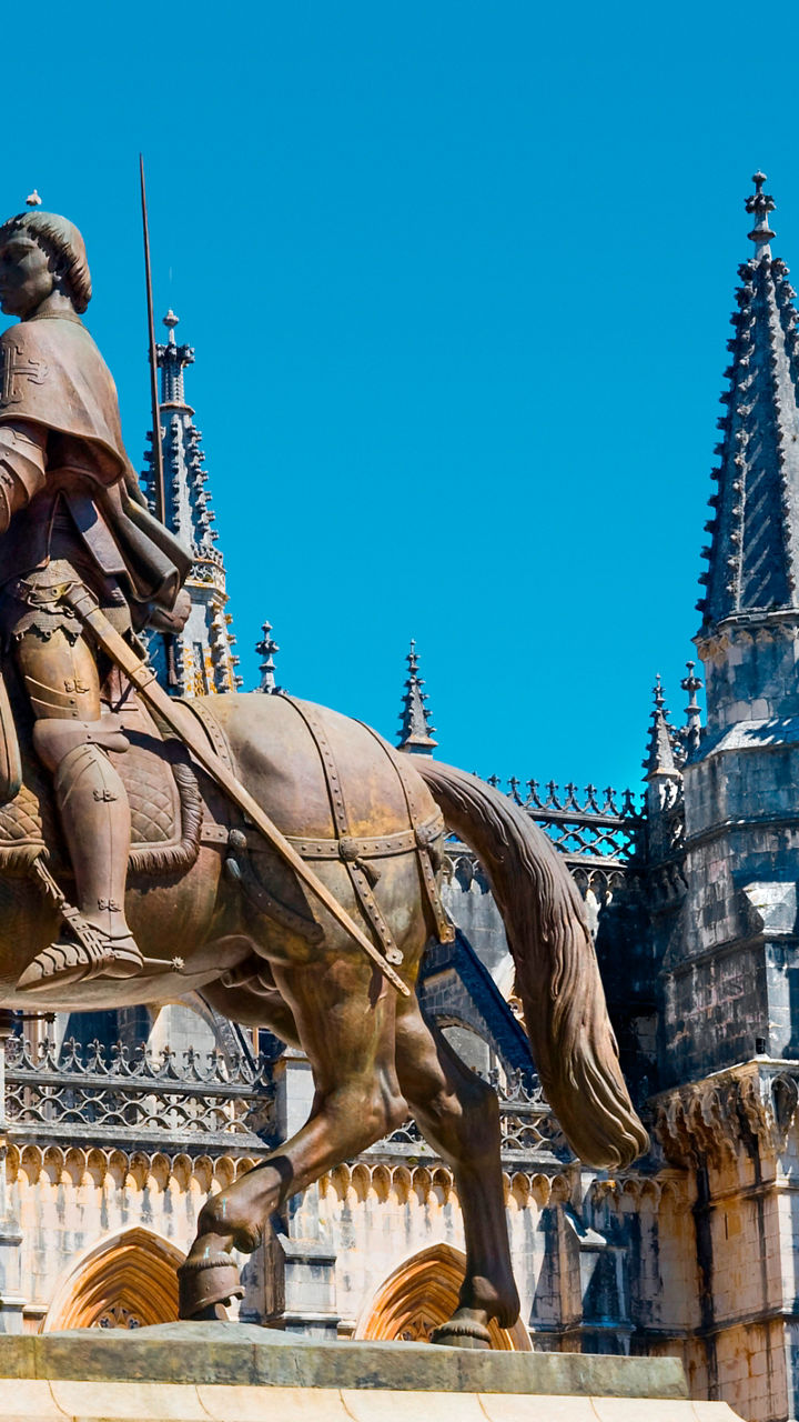 Equestrian statue near Gothic cathedral facade