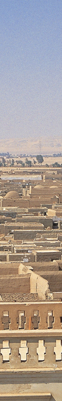Desert town with church tower and cross