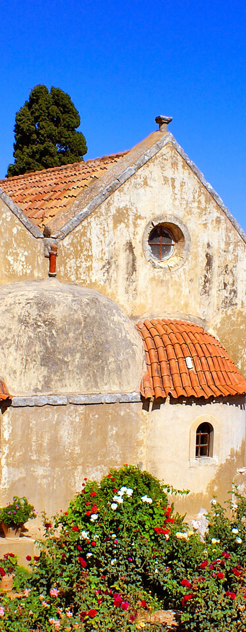 Historic stone church with garden courtyard