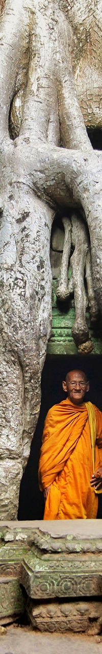 Monks in orange robes at ancient temple