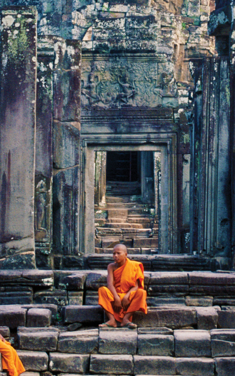 Monks at ancient Angkor Wat temple