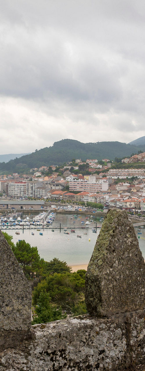 Scenic coastal town view from stone wall