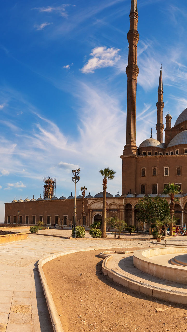 Historic mosque under vibrant blue sky