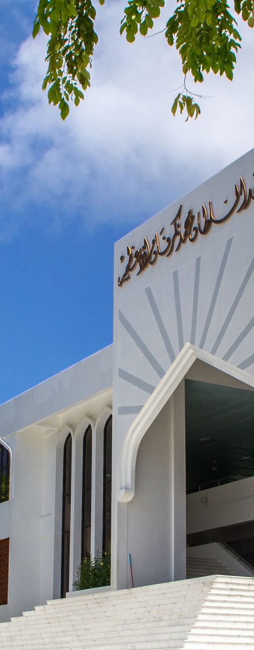 Grand mosque with white facade and minaret