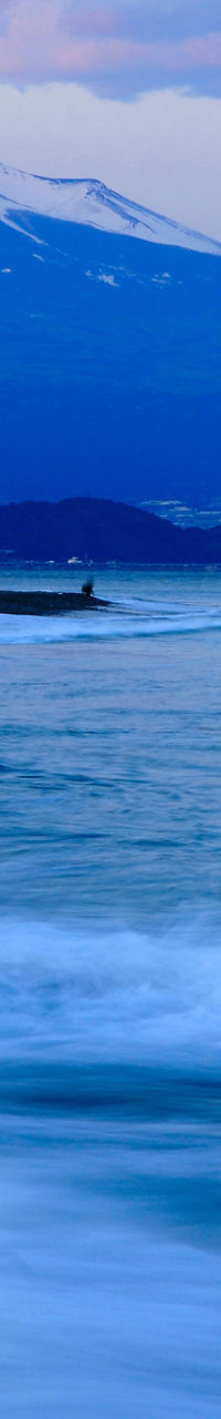 Mount Fuji at sunset with ocean waves