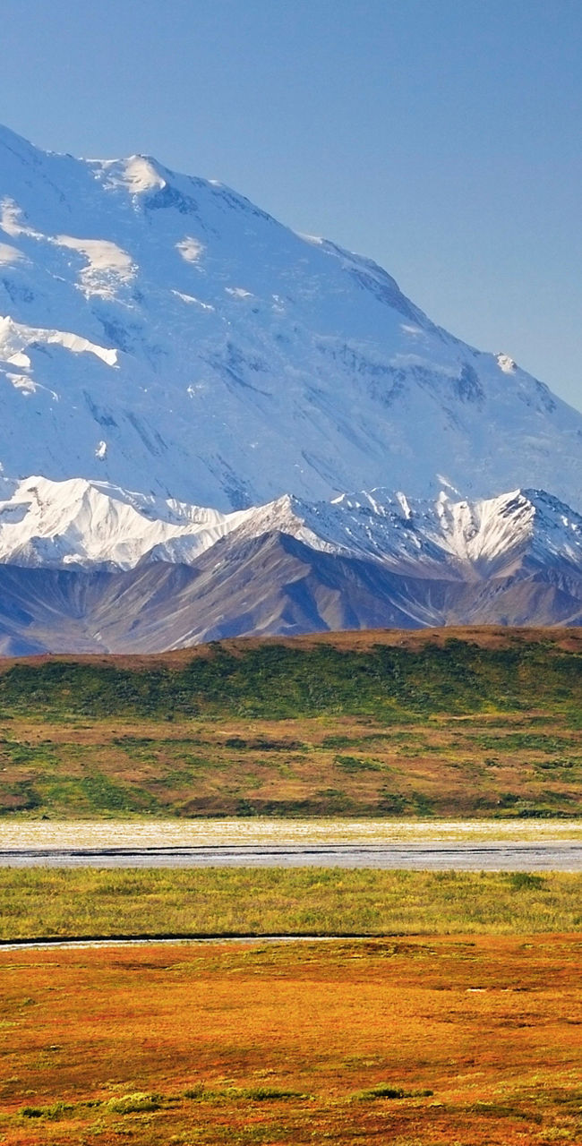 Snow-capped mountain with autumn landscape