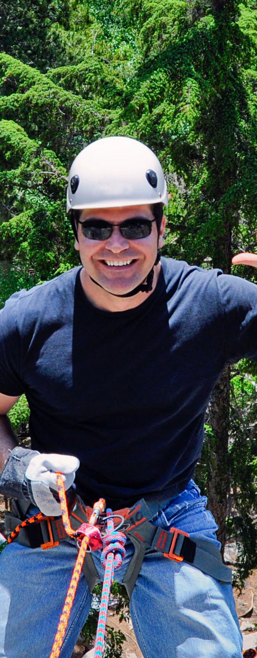 Rappelling adventure in forest setting