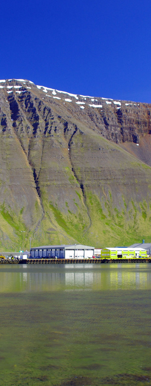 Coastal town with mountain backdrop