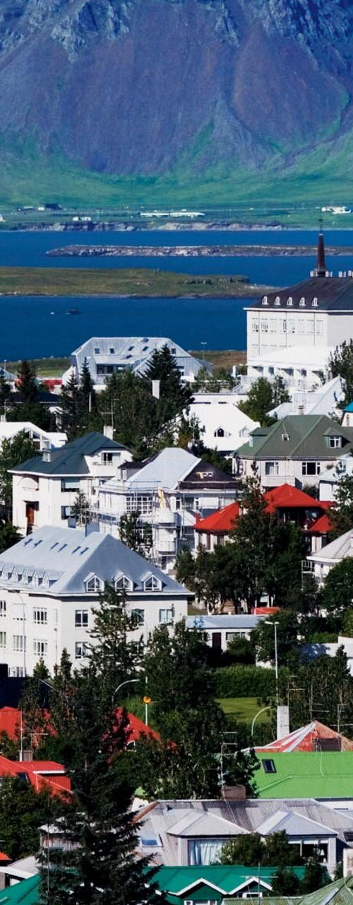 Colorful Icelandic town with mountain backdrop