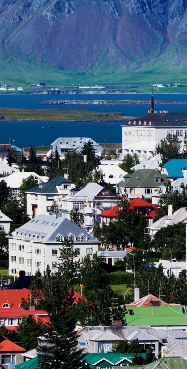 Colorful Icelandic town with mountain backdrop