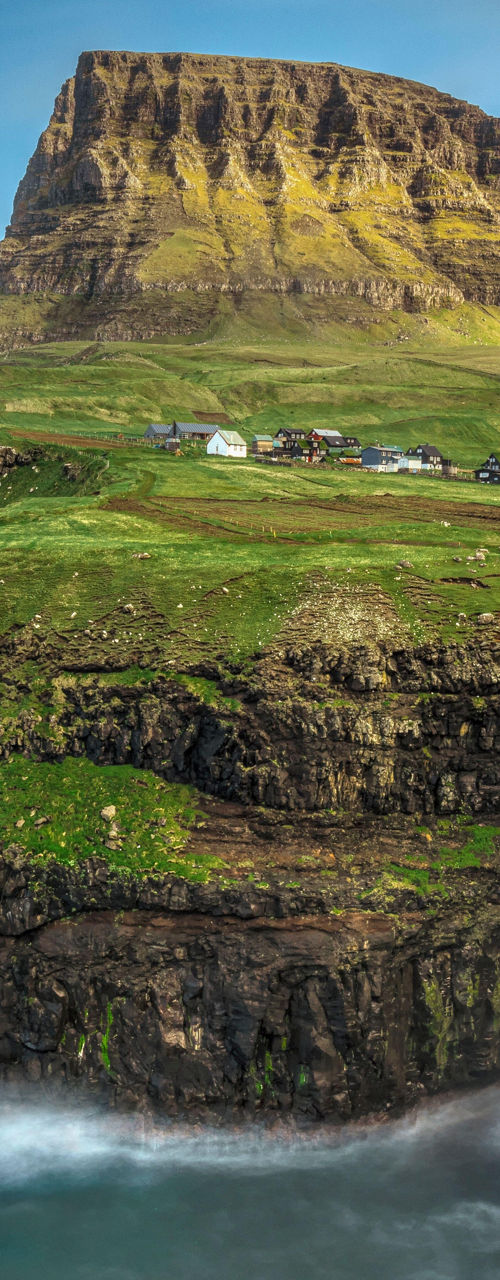 Scenic waterfall on rugged coastal cliffs
