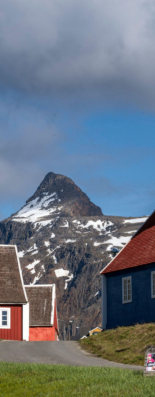 Colorful houses with mountain backdrop