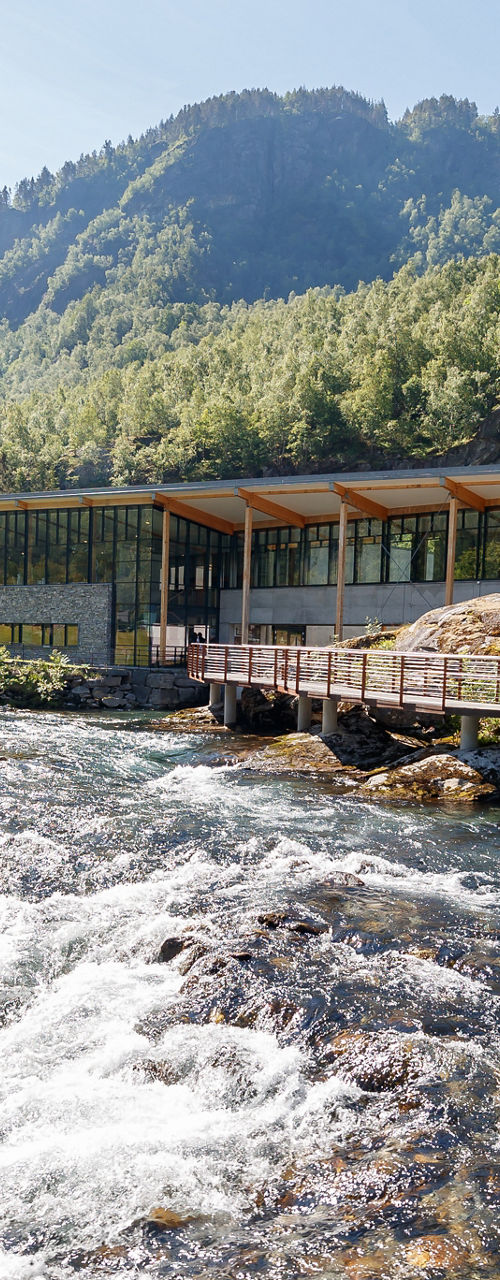 Scenic Riverside Building in Mountain Valley