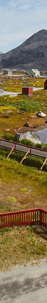 Scenic coastal village with red houses