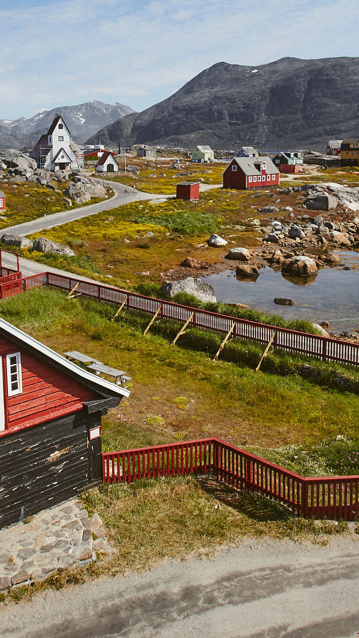 Scenic coastal village with red houses