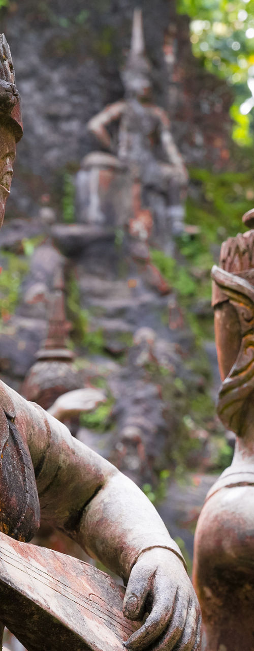 Ancient stone statues playing musical instruments