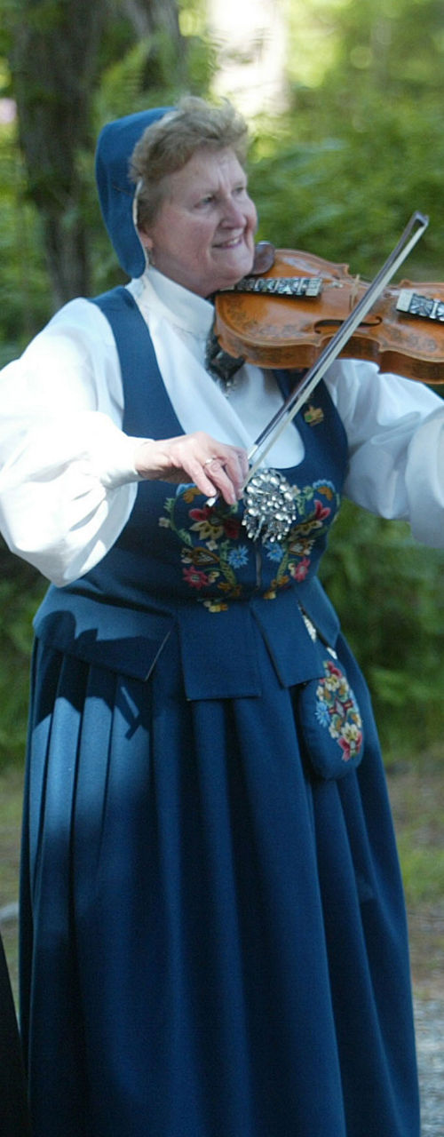 Traditional Folk Musicians in Outdoor Setting