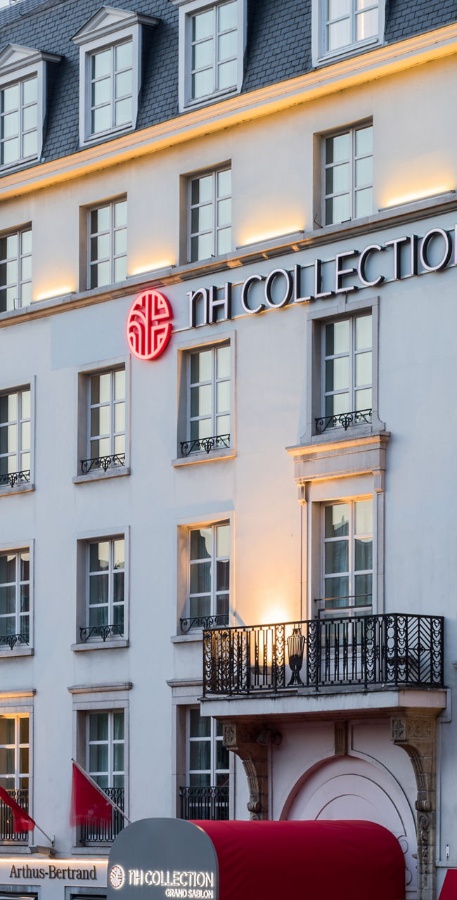 Elegant NH Collection Hotel Exterior at Dusk