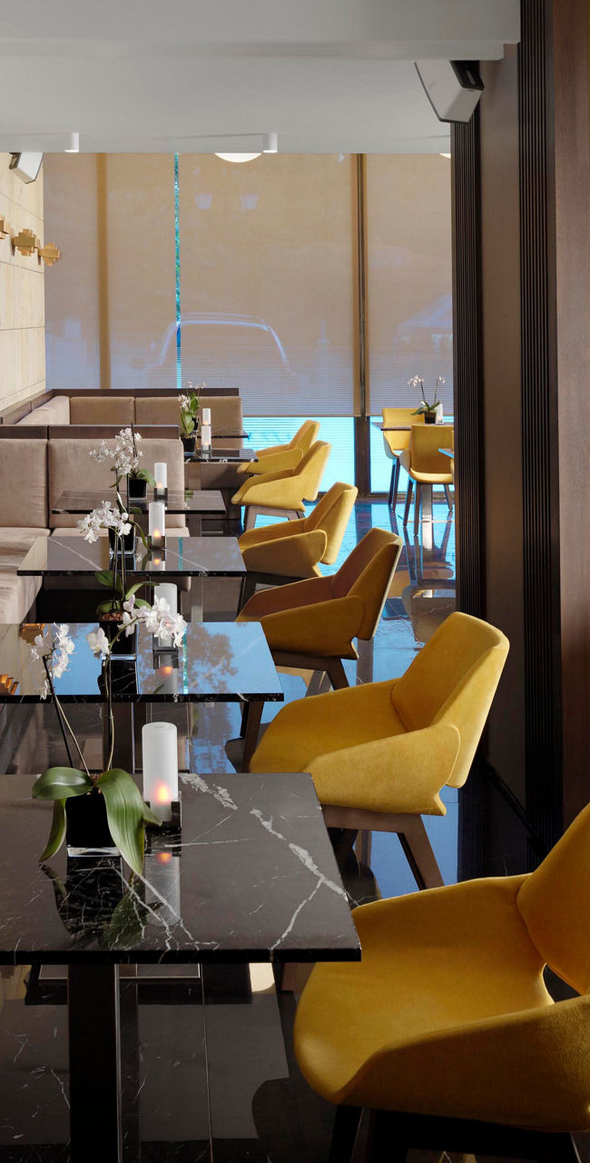 Modern lounge with yellow chairs and tables