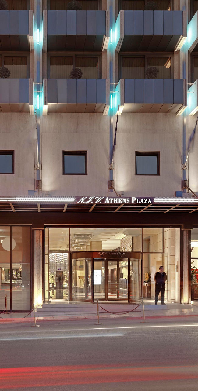 Elegant hotel facade at dusk in city