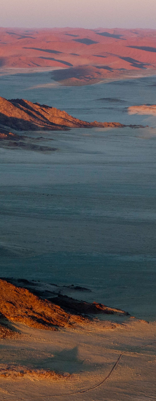 Aerial view of desert landscape at sunrise