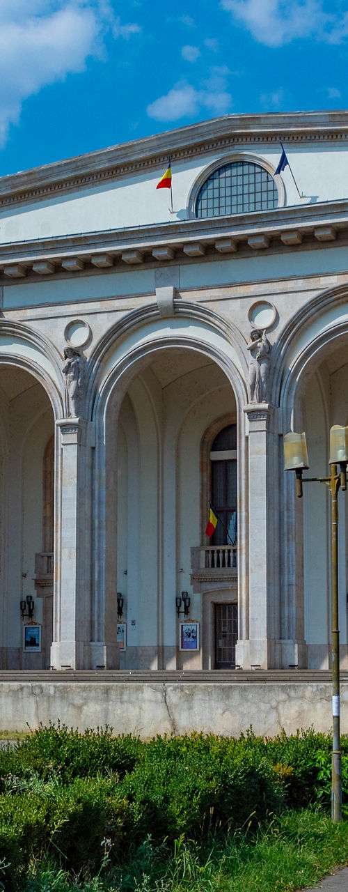 Historic building with arched facade in park