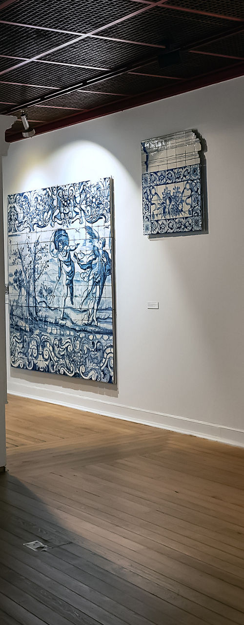 Gallery showcasing blue ceramic tile art