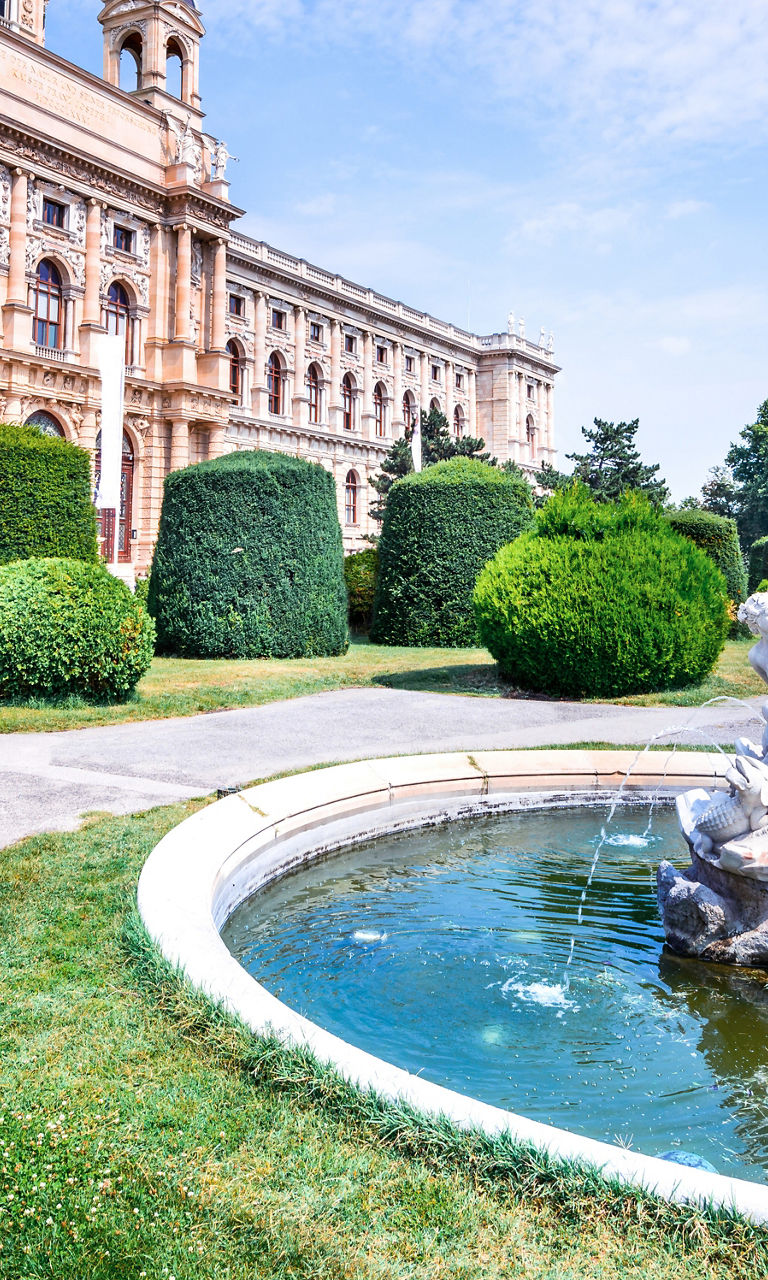 Historic building with ornate fountain