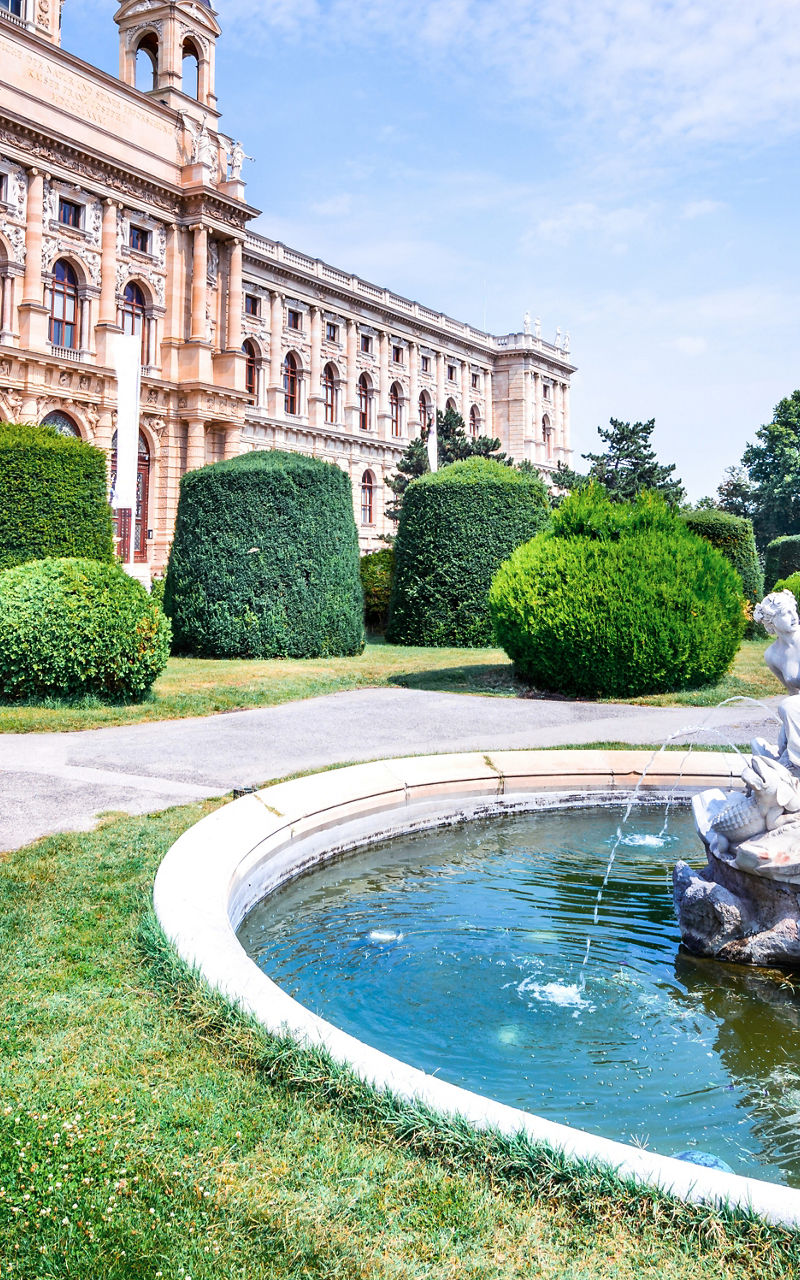 Historic building with ornate fountain