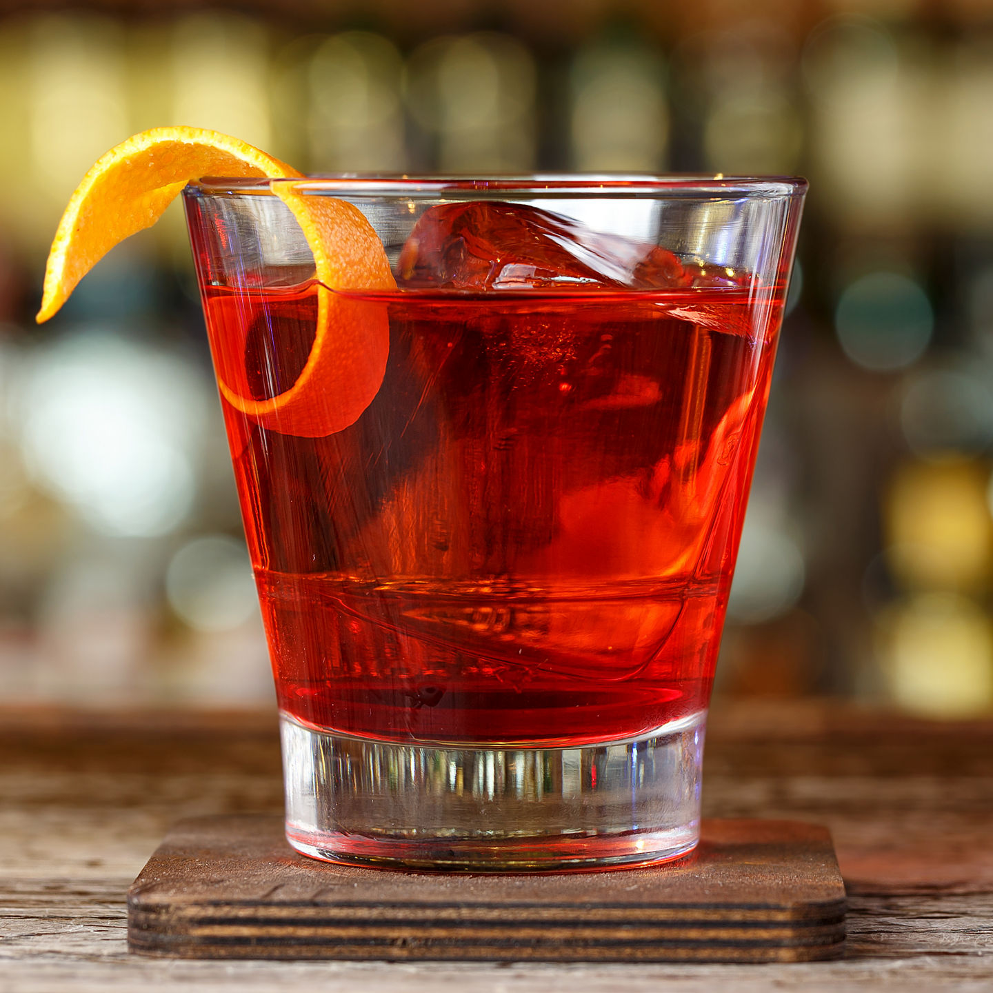 Classic cocktail with orange garnish