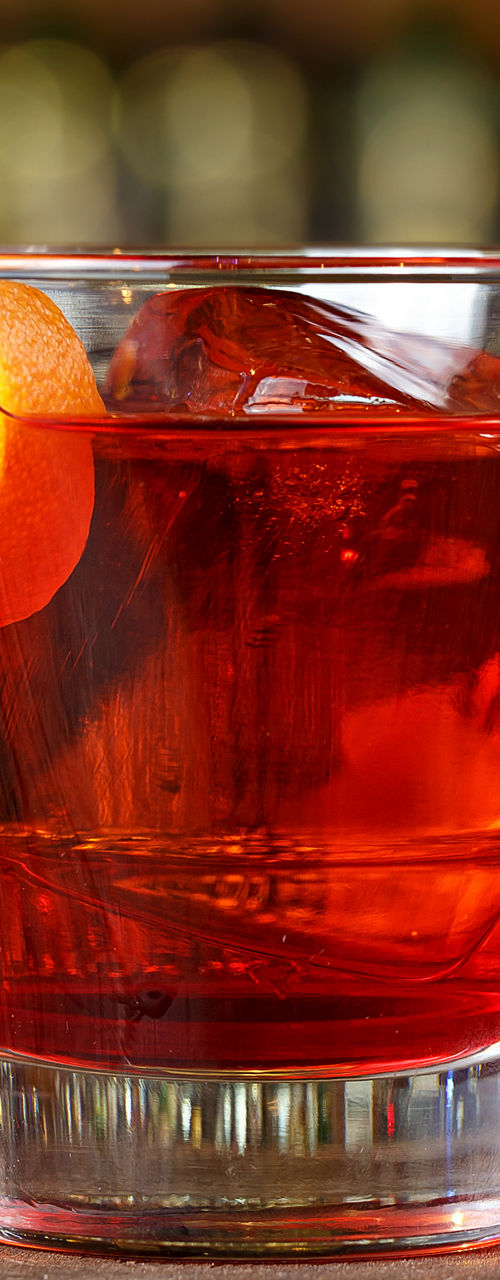 Classic cocktail with orange garnish
