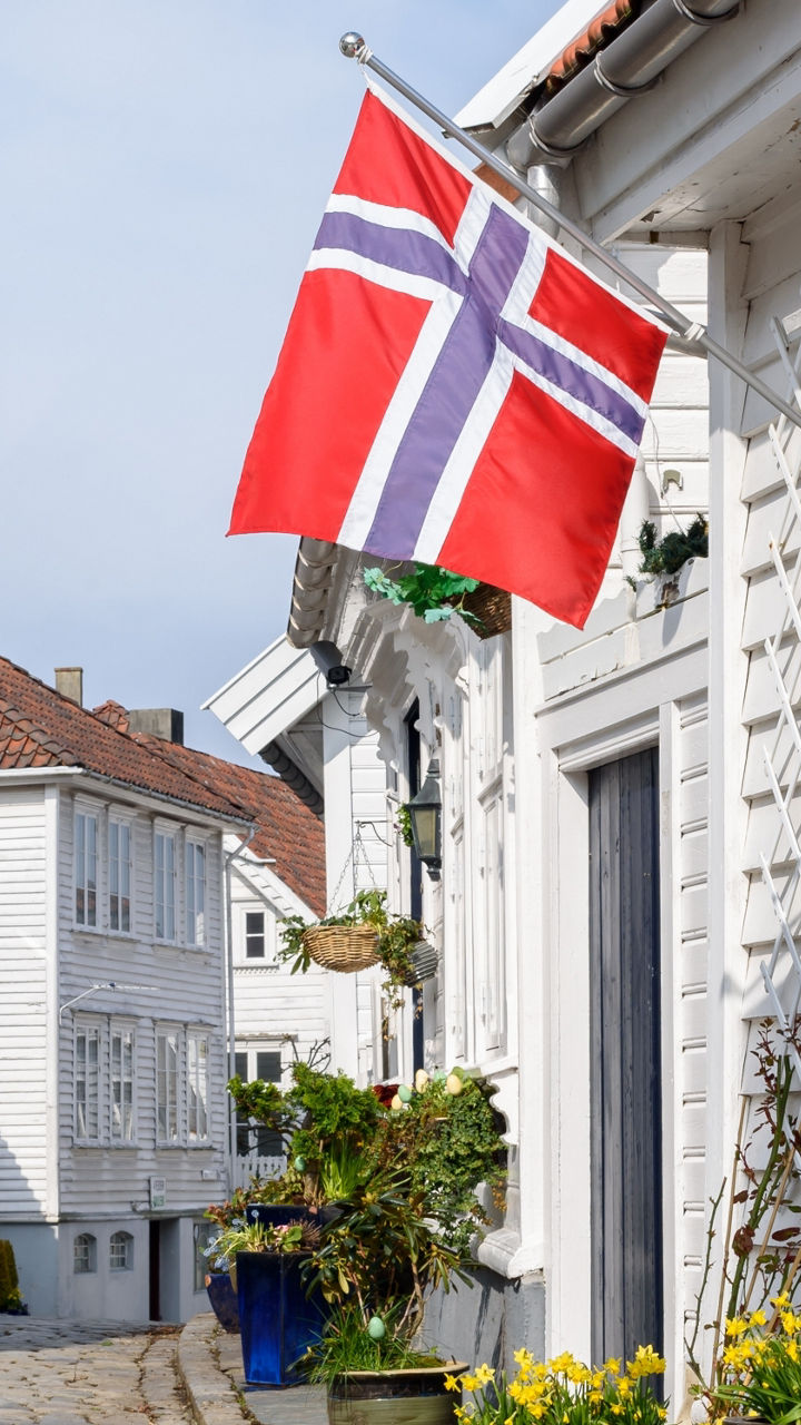 Norwegian street with flag and white houses