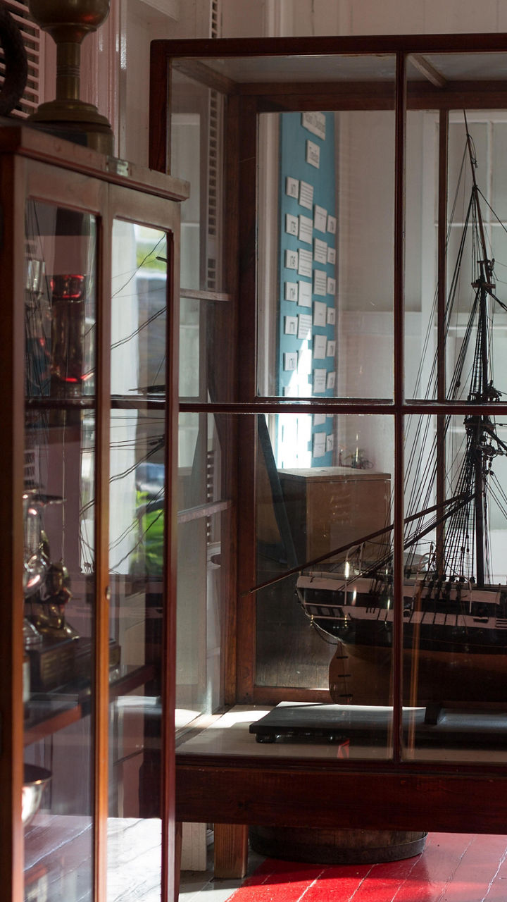 Model ship in museum display case