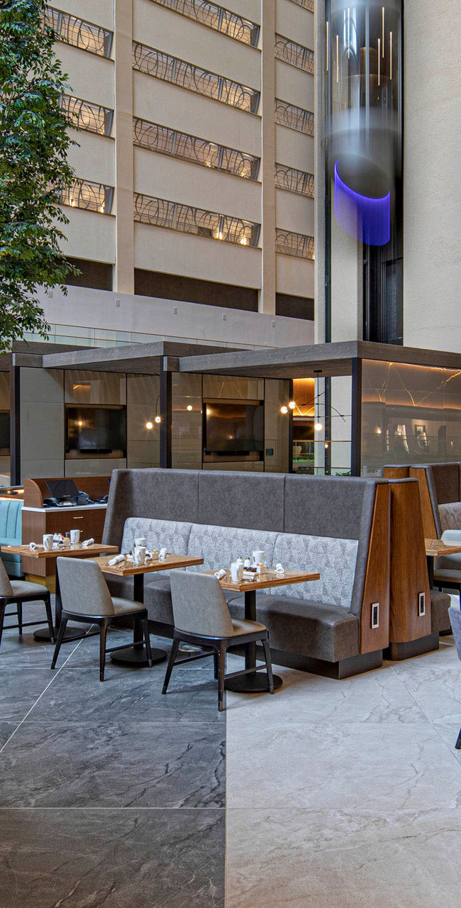 Modern hotel atrium with dining area