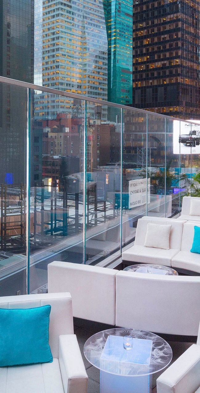 Modern rooftop lounge overlooking city skyline