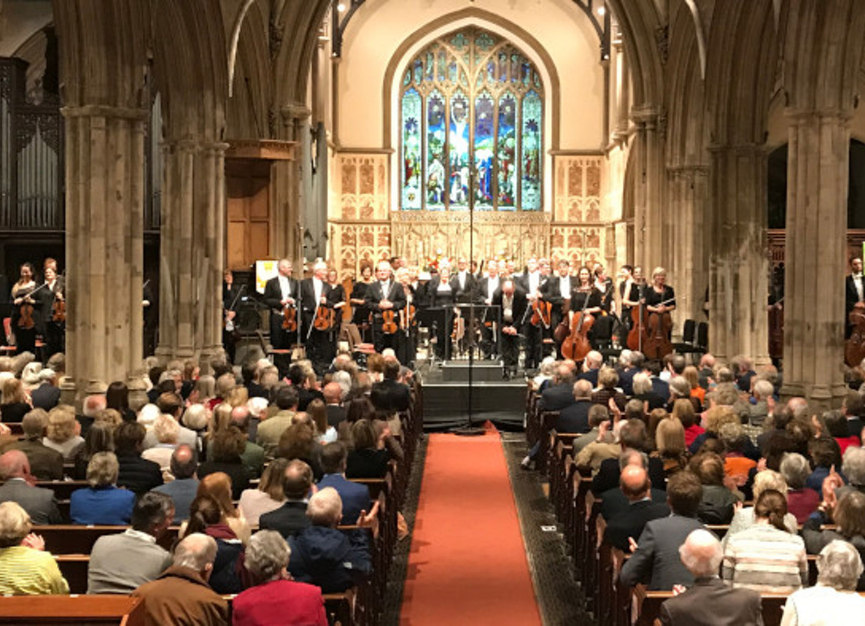 Orchestra performance in historic church setting