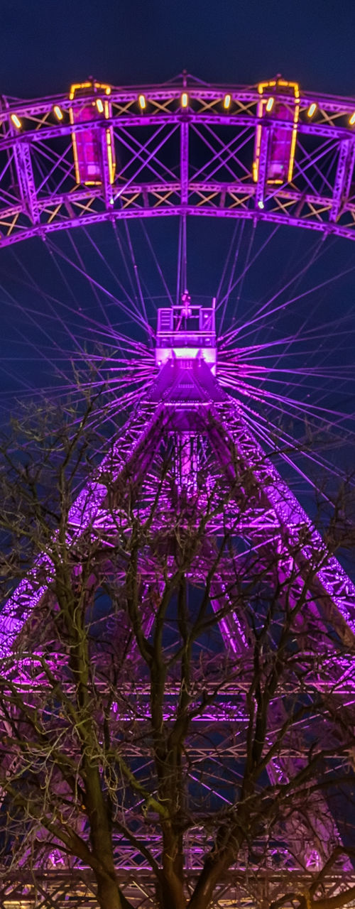 Illuminated Ferris Wheel at Nighttime