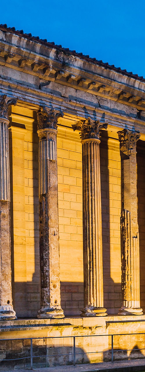 Illuminated Roman temple at dusk in France