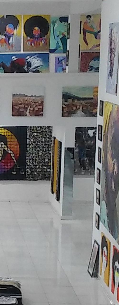Art gallery with colorful paintings on display