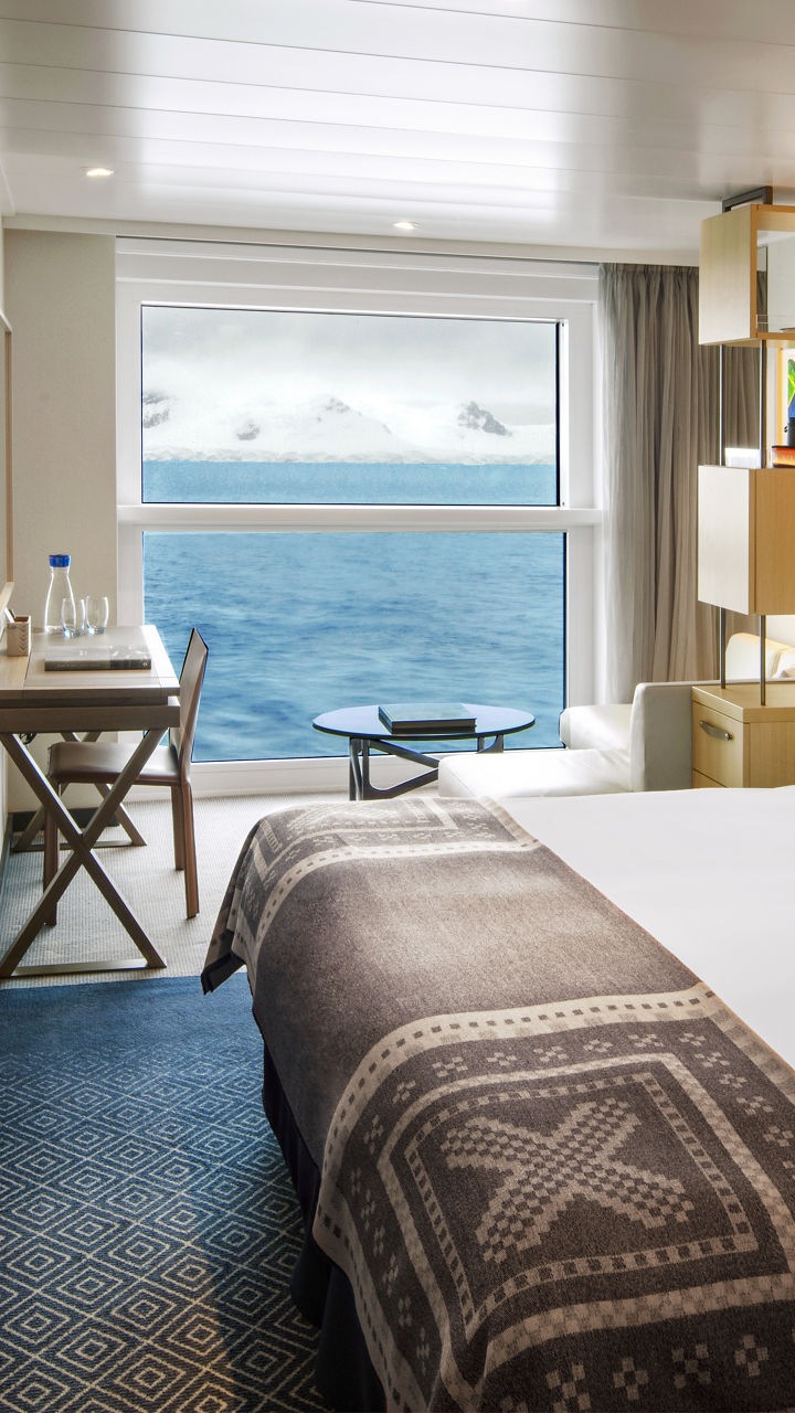 Modern cruise ship cabin with ocean view