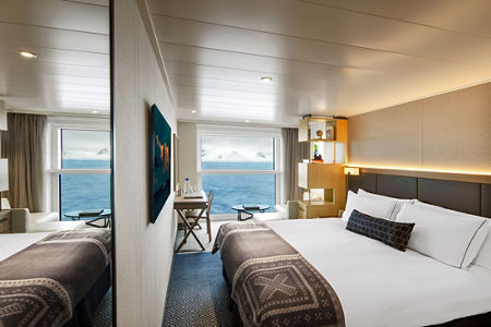 Modern cruise ship cabin with ocean view