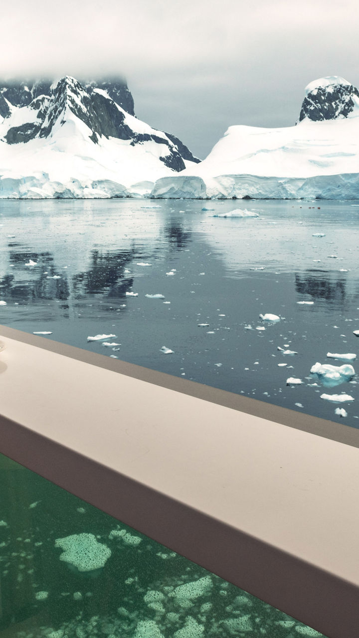 Scenic view of icy mountains from window