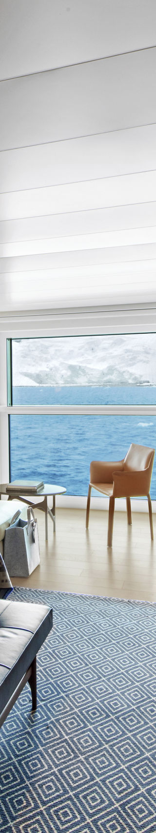 Modern cruise ship cabin with ocean view
